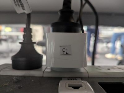 Figure 1 A Zigbee smart plug monitoring power under desk F2